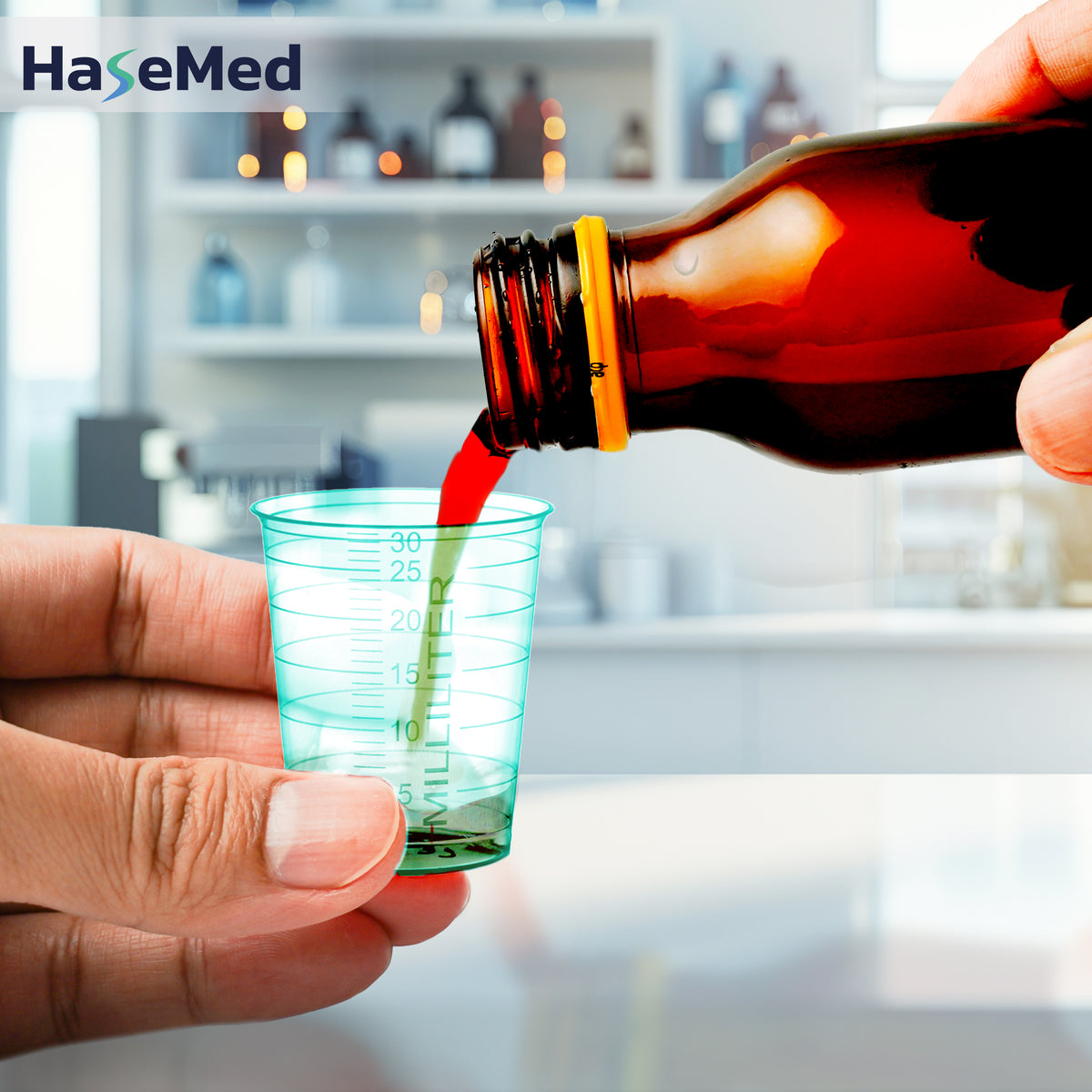 Green HaseMed 30 ml medicine cup in use; sold as 80 cups of one colour, without lids. Liquid and bottle not included.