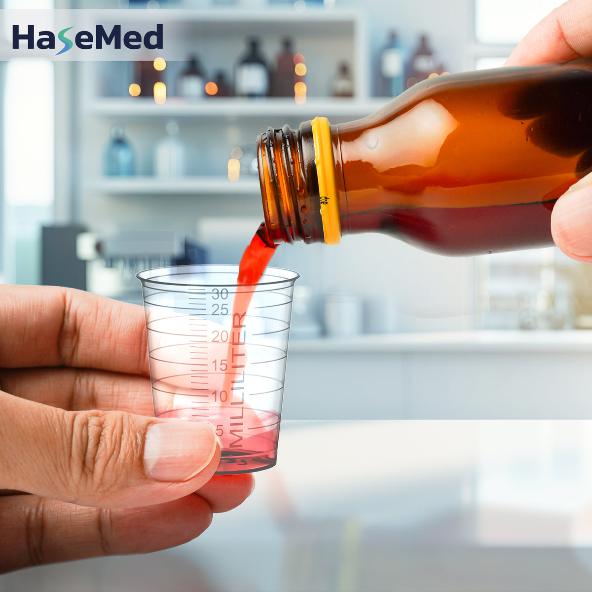 Transparent HaseMed 30 ml medicine cup in use; sold as 80 cups of one colour, without lids. Liquid and bottle not included.