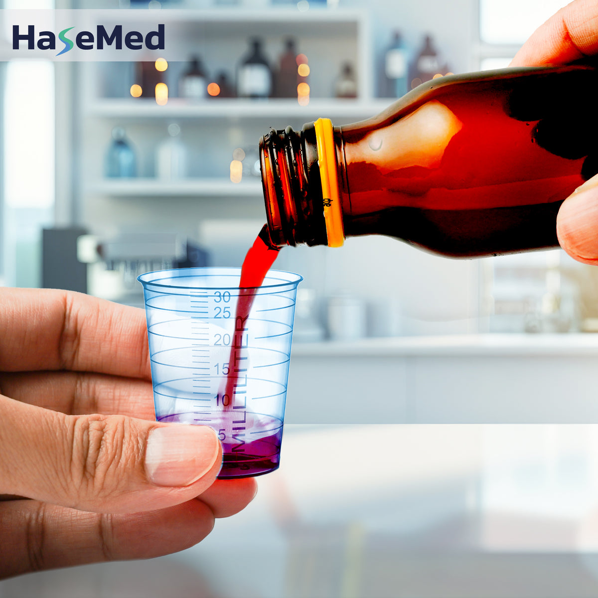 Blue HaseMed 30 ml medicine cup in use; sold as 80 cups of one colour, without lids. Liquid and bottle not included.